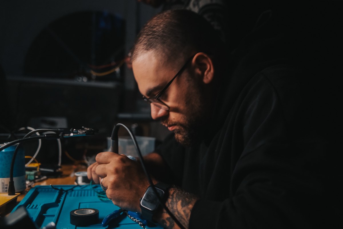 Close view of soldering work at the electronics bench