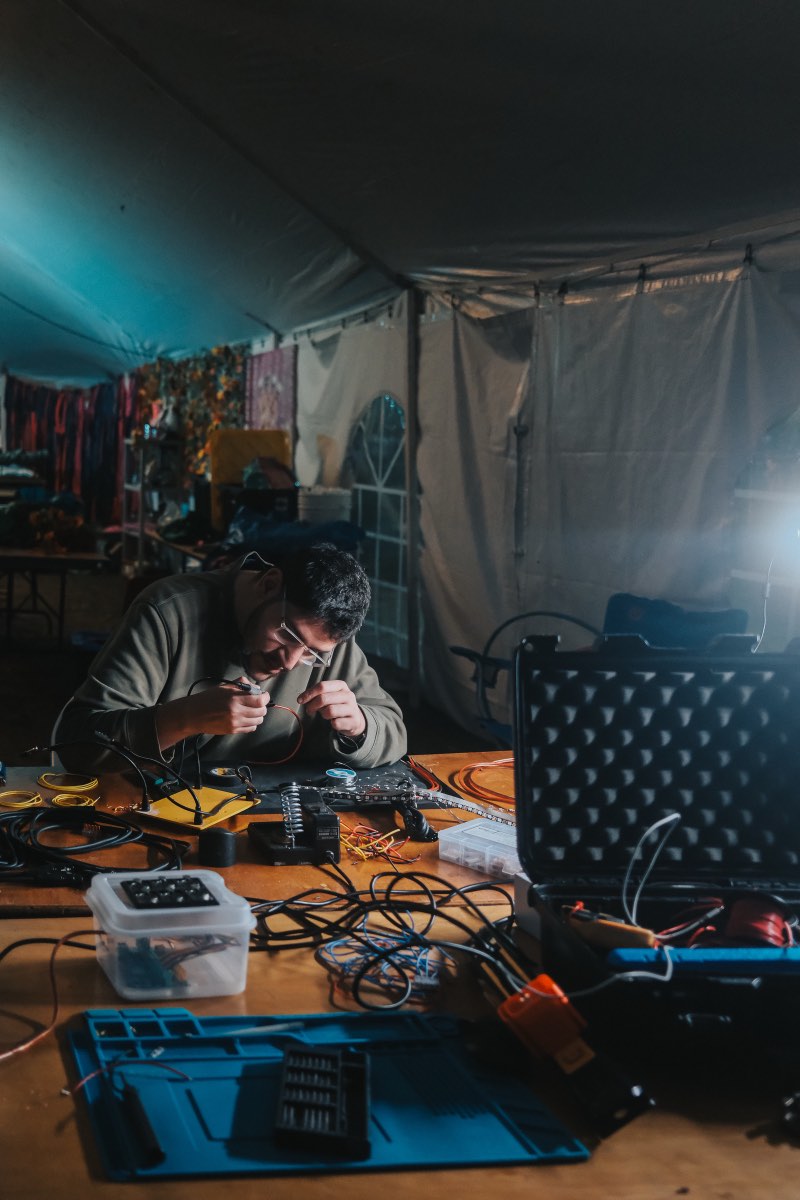Cable preparation and soldering inside the workshop tent