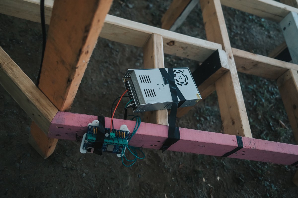 Power supply and controller mounted beneath the timber frame