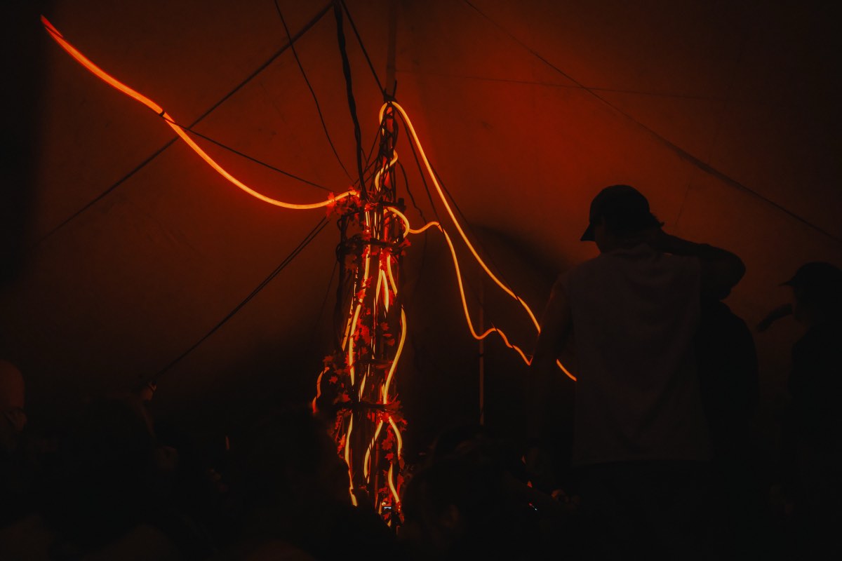 Amber lighting around the central structure during the event